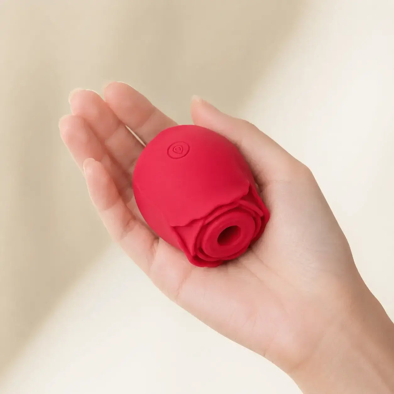 The Rose Toy shown in hand for size reference